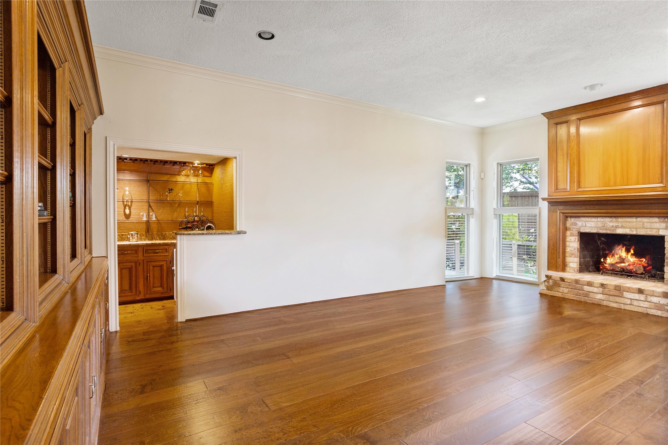 22015 Fielder Drive Katy, TX 77450 - Photo 11 of 38 a view of an empty room with wooden floor and a window