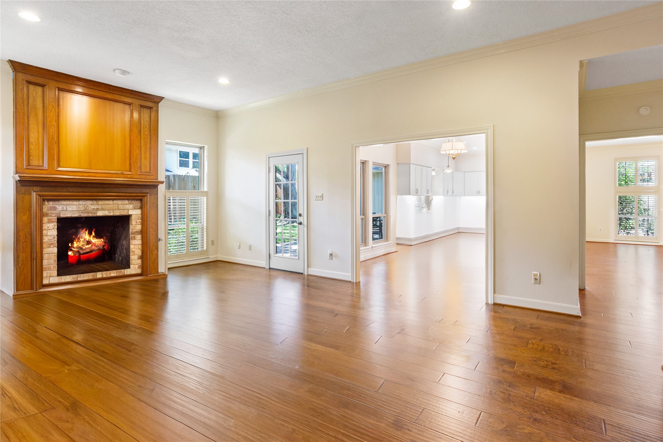 22015 Fielder Drive Katy, TX 77450 - Photo 13 of 38 a view of an empty room with wooden floor fireplace and a window