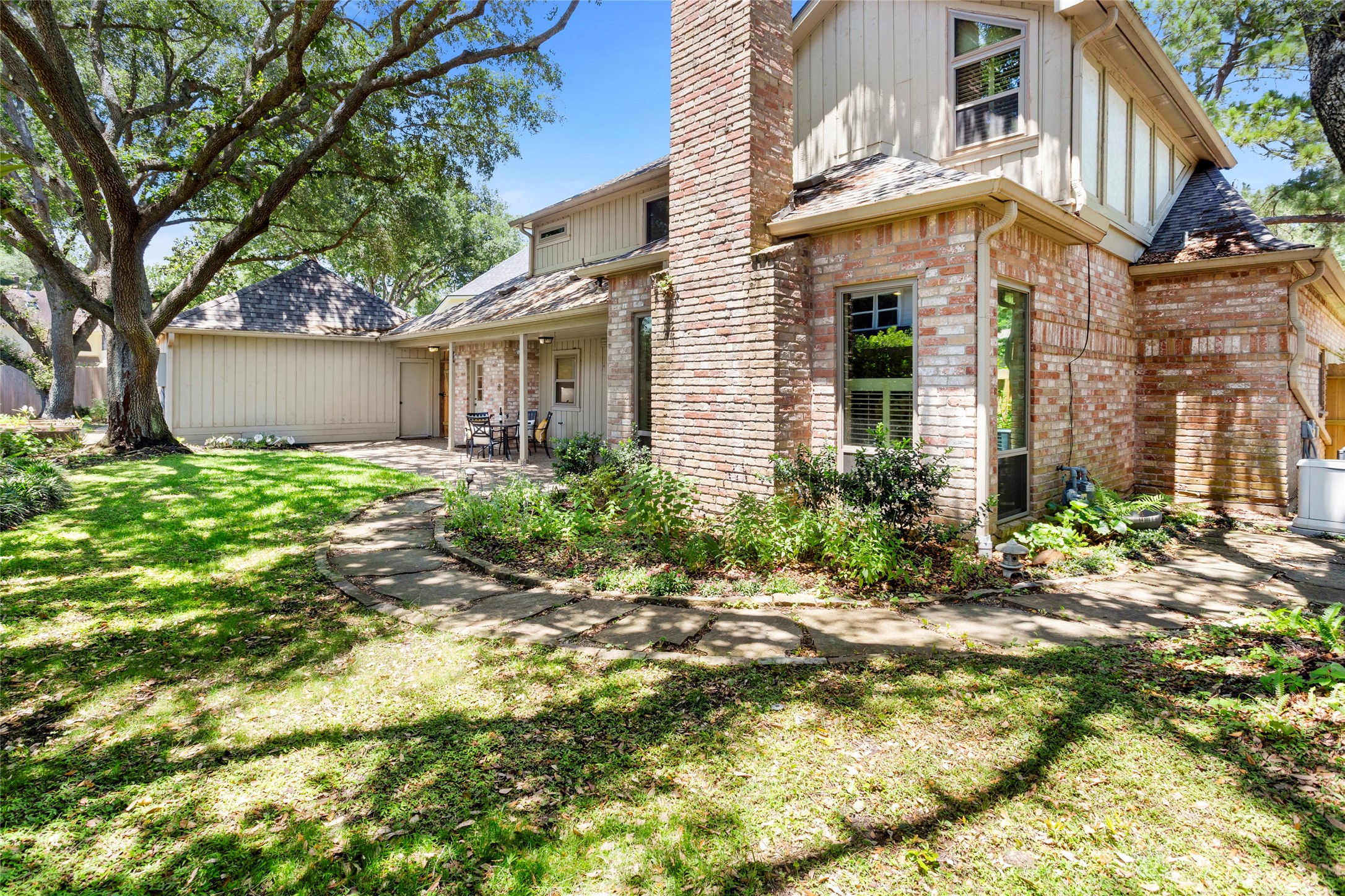 22015 Fielder Drive Katy, TX 77450 - Photo 35 of 38 a view of a house with a large tree and a yard