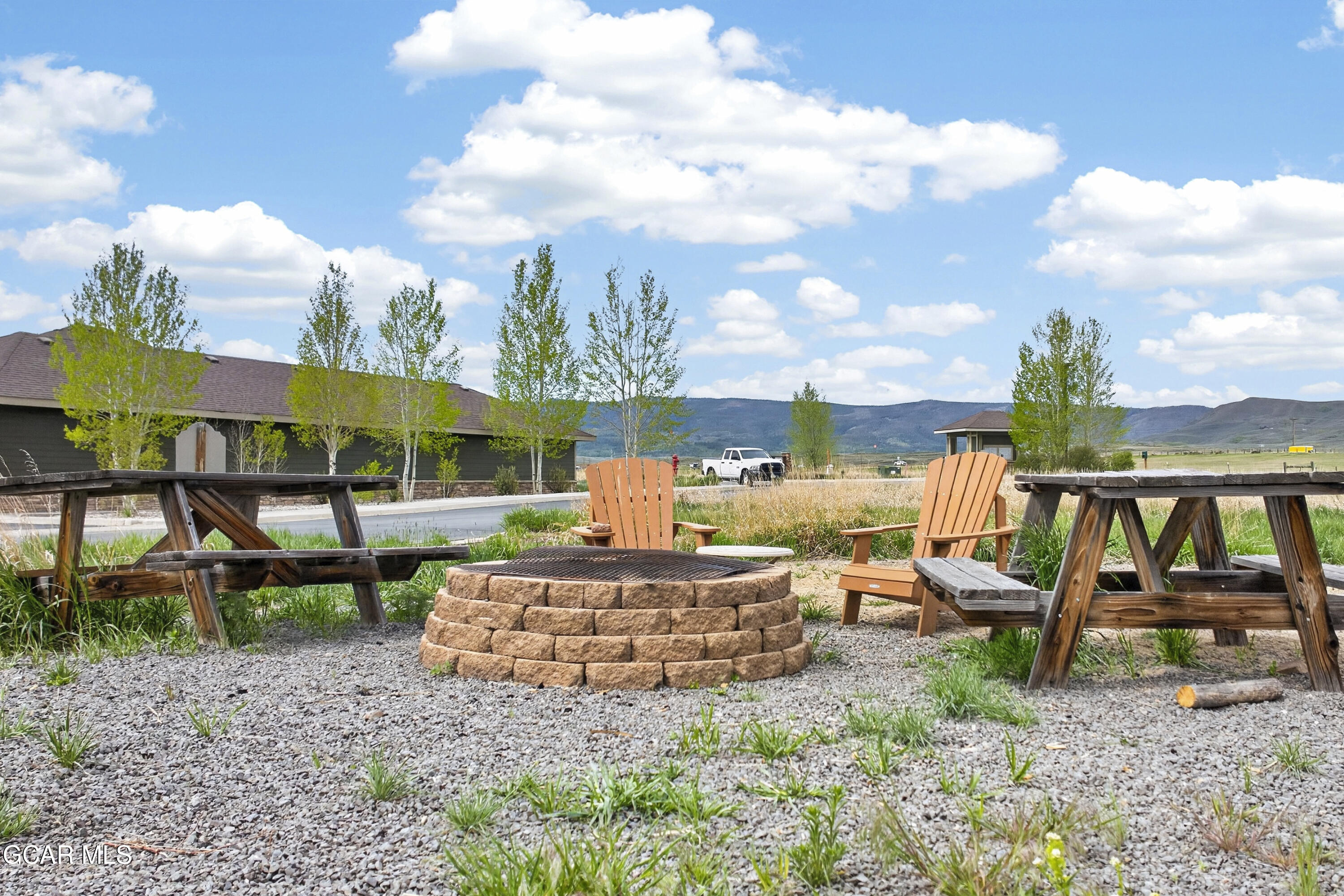 158 Village Road Granby, CO 80446 - Photo 25 of 46 a view of a house with backyard and sitting area
