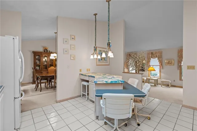 a bedroom with a bed and dresser with mirror