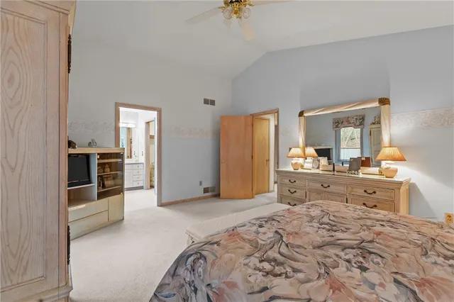 a living room with fireplace furniture and a large window