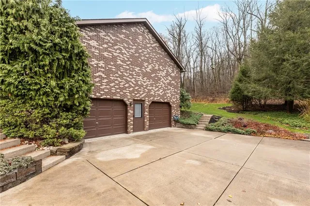 a room with stainless steel appliances kitchen island granite countertop furniture and a kitchen view