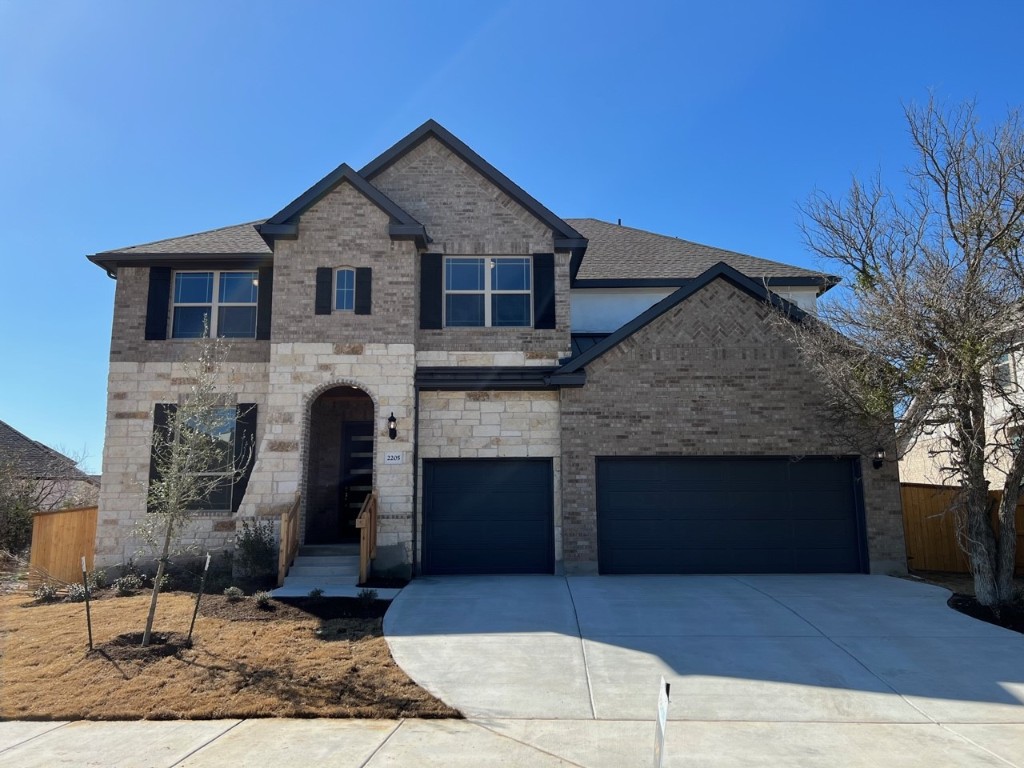 a front view of a house with yard