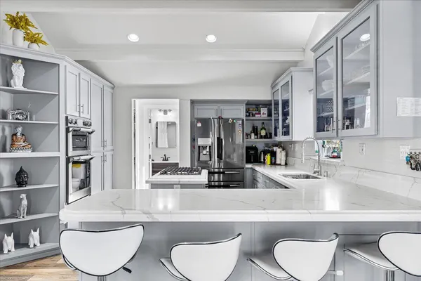 a bathroom with a toilet a sink and a mirror