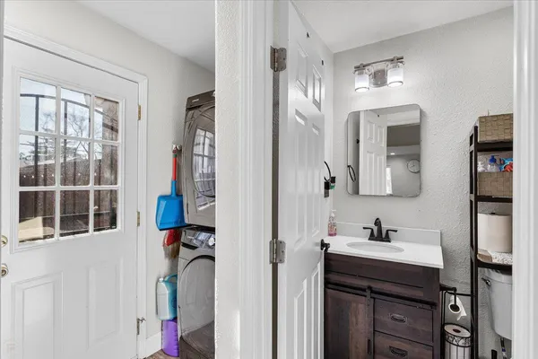 a en suite bathroom with a sink and a mirror