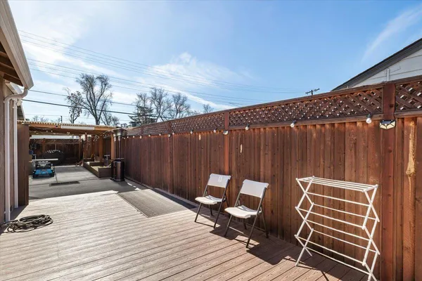 a view of deck with wooden floor and outdoor seating