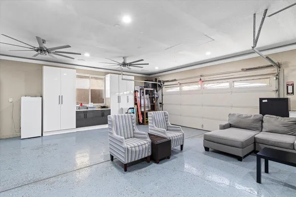 a living room with furniture and walk in closet