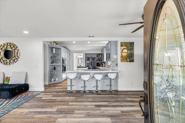 a view of living room filled with furniture and window