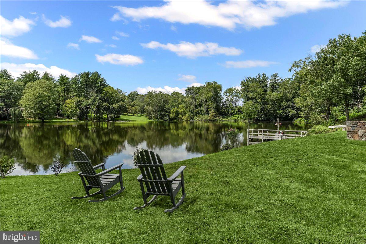 80 Heyburn Road Chadds Ford, PA 19317 - Photo 17 of 76 a lake view with a garden and trees