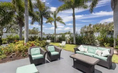 a view of a patio with couches and a fire pit