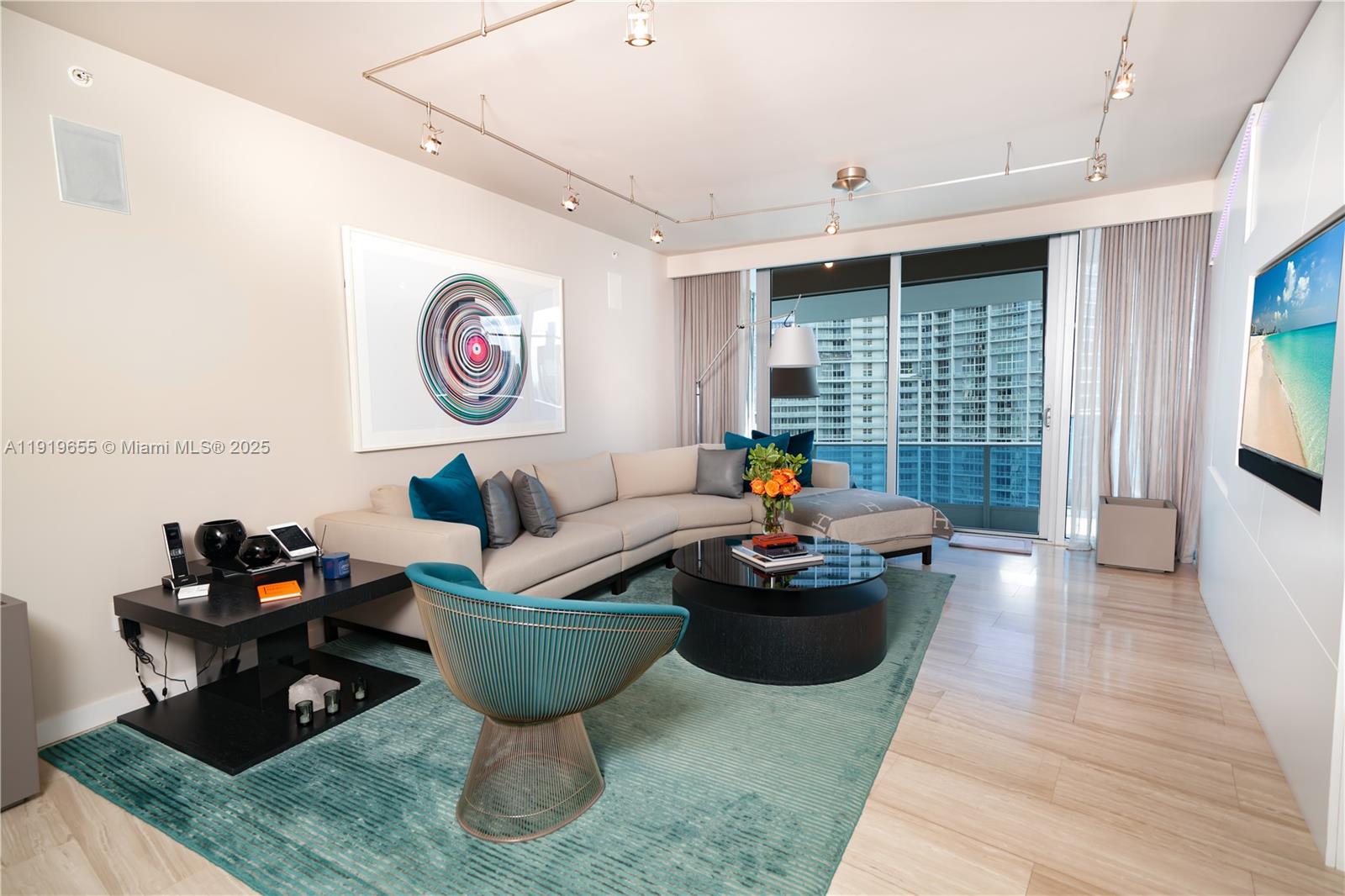 200 Biscayne Blvd Way, Unit 3906 Miami, FL 33131 - Photo 5 of 26 a living room with furniture and a table