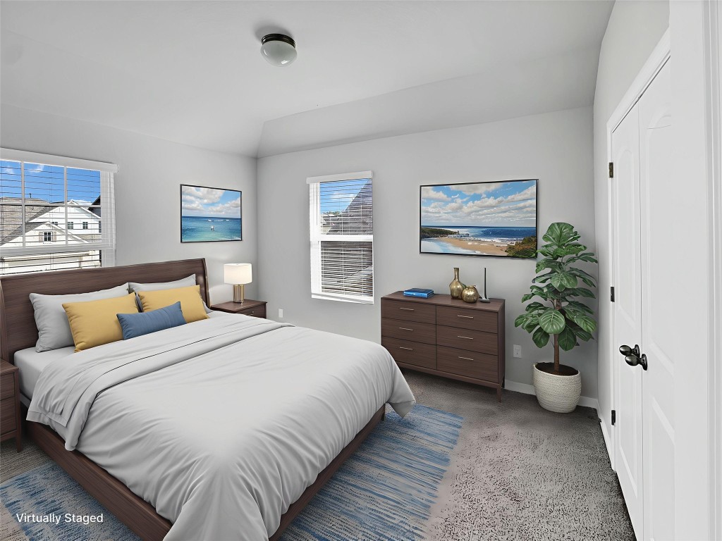 2437 Roosevelt Road Leander, TX 78641 - Photo 23 of 35 Secondary bedroom upstairs with a closet, carpet floors, and vaulted ceiling