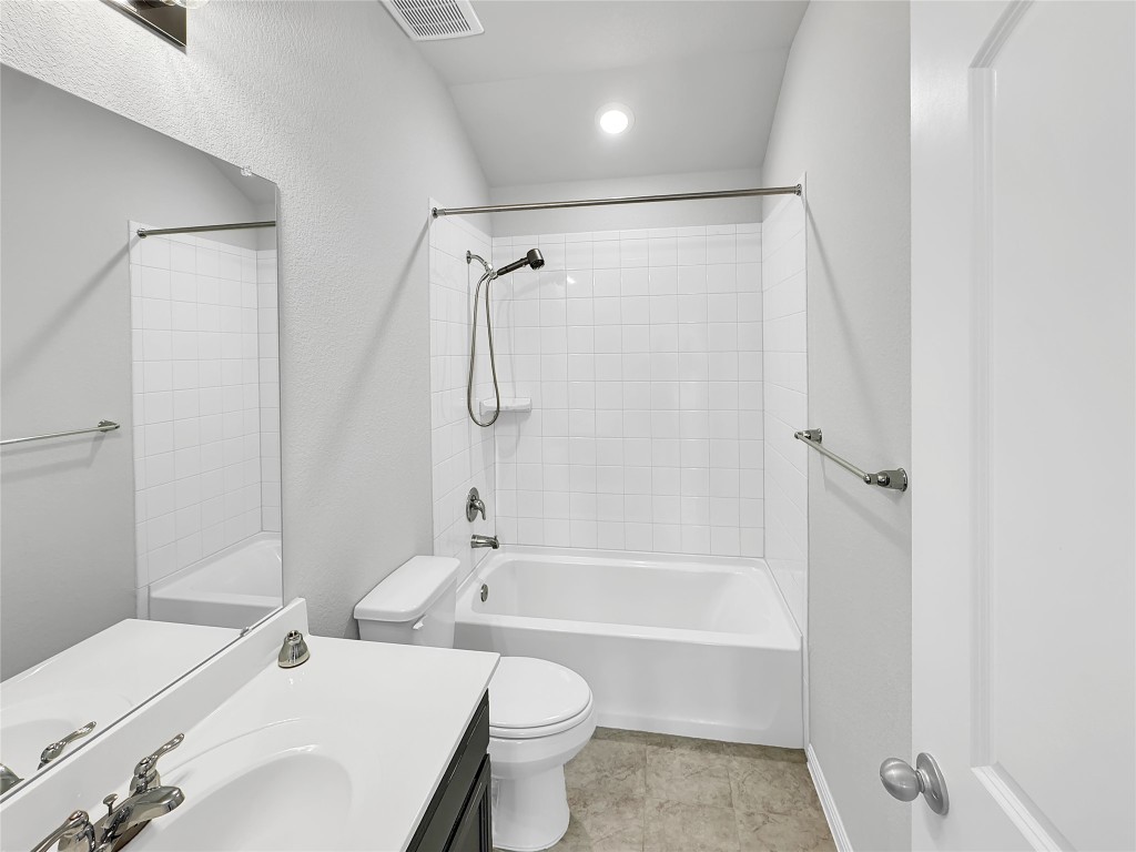 2437 Roosevelt Road Leander, TX 78641 - Photo 24 of 35 Full bath featuring shower / bath combination, vanity, and light tile patterned floors