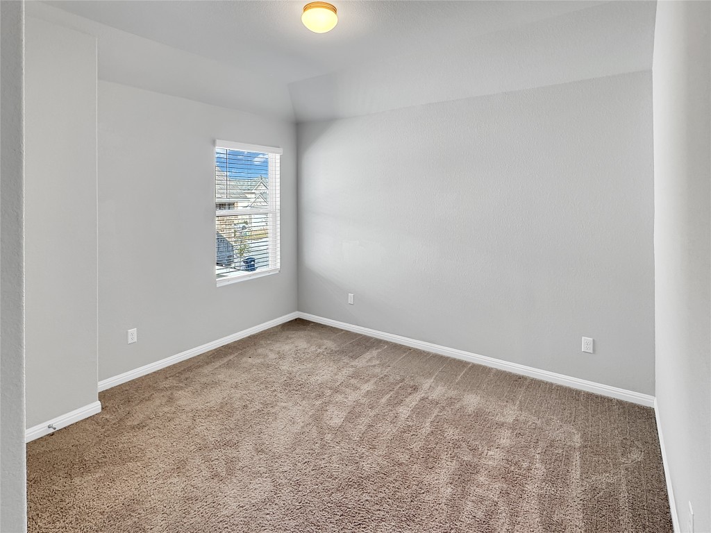 2437 Roosevelt Road Leander, TX 78641 - Photo 25 of 35 Secondary bedroom with carpet floors.