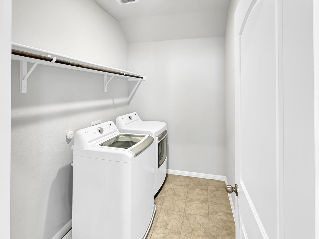 2437 Roosevelt Road Leander, TX 78641 - Photo 27 of 35 Spacious Laundry area with washing machine and clothes dryer.