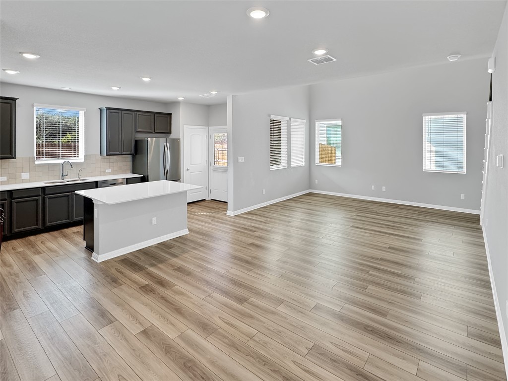 2437 Roosevelt Road Leander, TX 78641 - Photo 35 of 35 As you come around you see the open floor plan for the splendor it is.