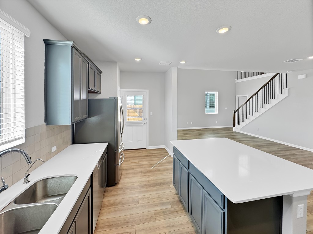 2437 Roosevelt Road Leander, TX 78641 - Photo 7 of 35 Another angle of this beautiful kitchen with quartz counters.