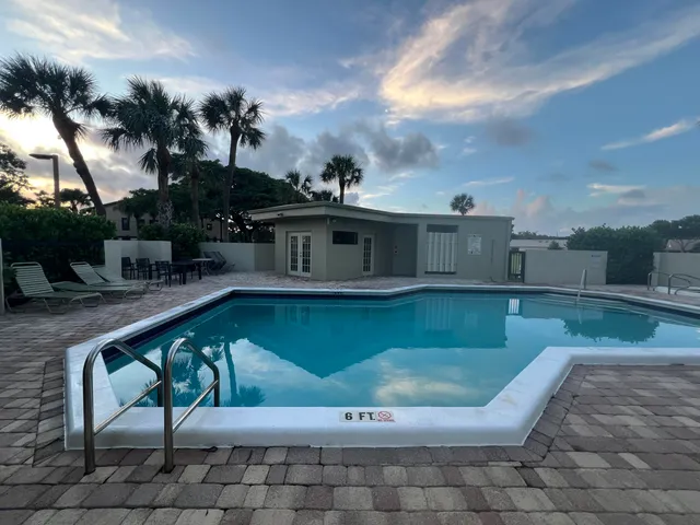 a view of a swimming pool with a patio
