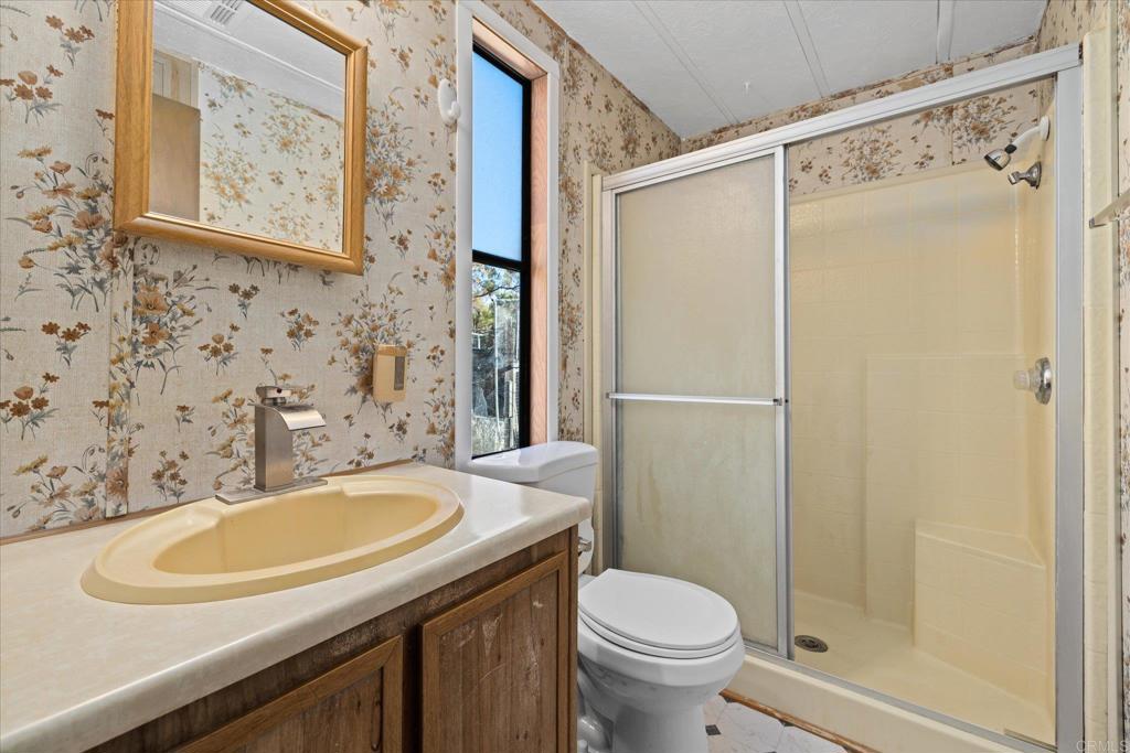 59063 Reynolds Way Anza, CA 92539 - Photo 14 of 34 a bathroom with a sink and a mirror