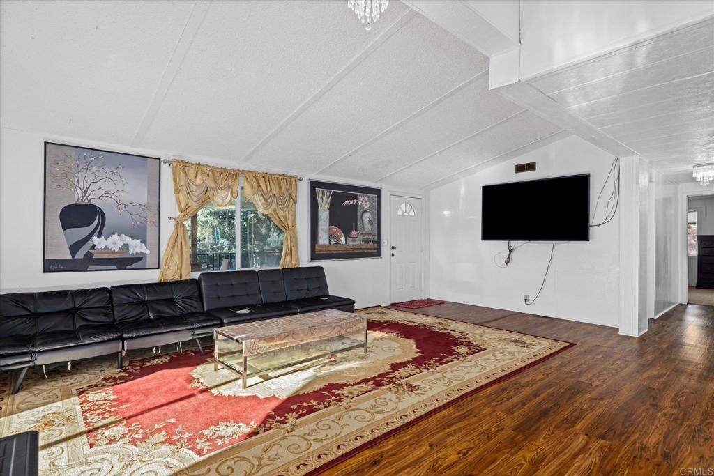 59063 Reynolds Way Anza, CA 92539 - Photo 2 of 34 a living room with flat screen tv and a couch