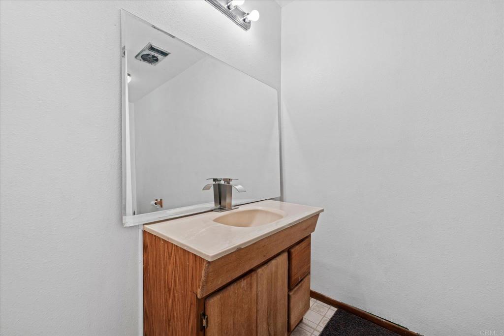 59063 Reynolds Way Anza, CA 92539 - Photo 23 of 34 a bathroom with a sink and a mirror