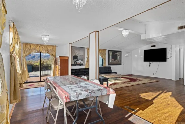 a kitchen with a table and chairs in it