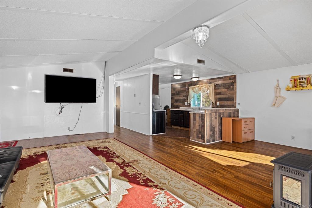 59063 Reynolds Way Anza, CA 92539 - Photo 5 of 34 a living room with furniture and a flat screen tv