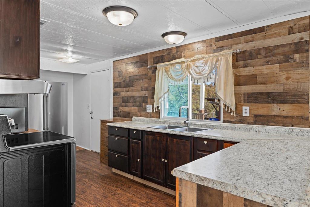 59063 Reynolds Way Anza, CA 92539 - Photo 7 of 34 a kitchen with a sink and large window
