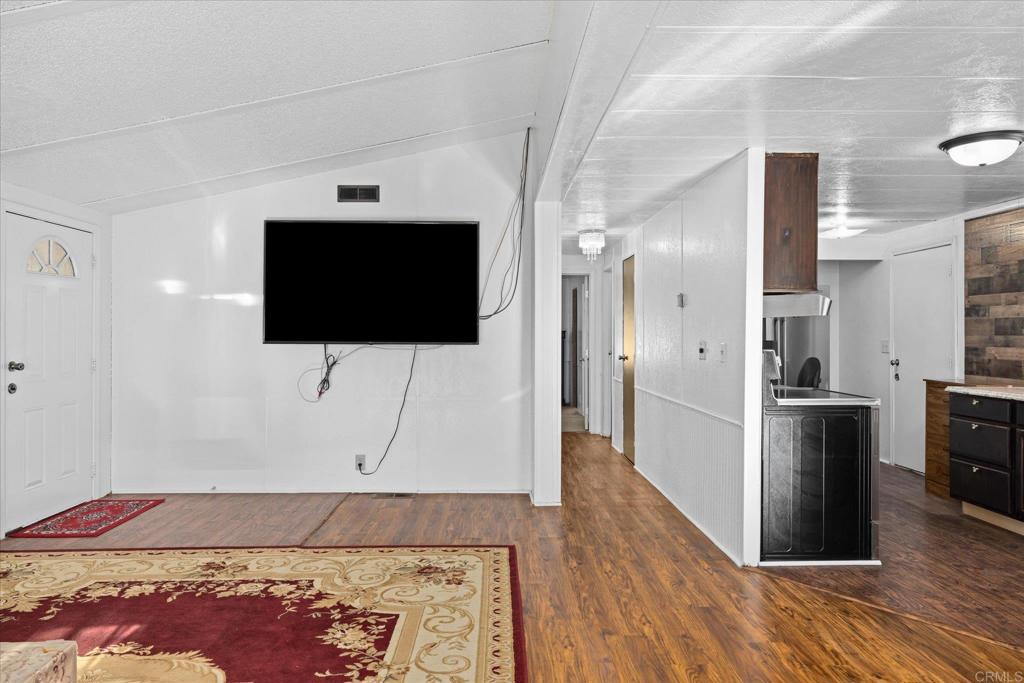 59063 Reynolds Way Anza, CA 92539 - Photo 9 of 34 a living room with a flat screen tv and a rug