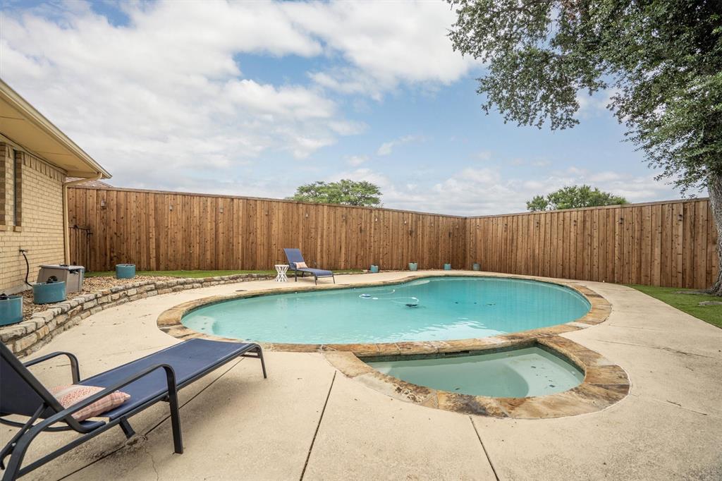 2214 Valley Mill Carrollton, TX 75006 - Photo 31 of 36 a view of a swimming pool with a lounge chairs