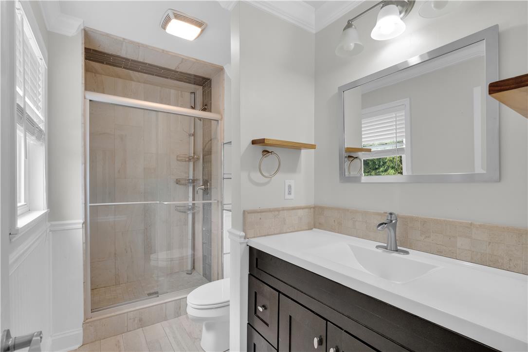 3396 Darien Road Bethlehem, PA 18020 - Photo 29 of 44 A well-appointed bathroom features a spacious shower and a modern vanity with a large mirror.
