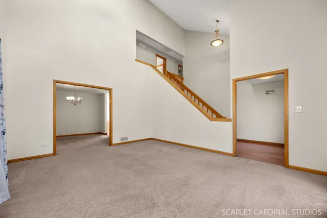 a view of an empty room with stairs