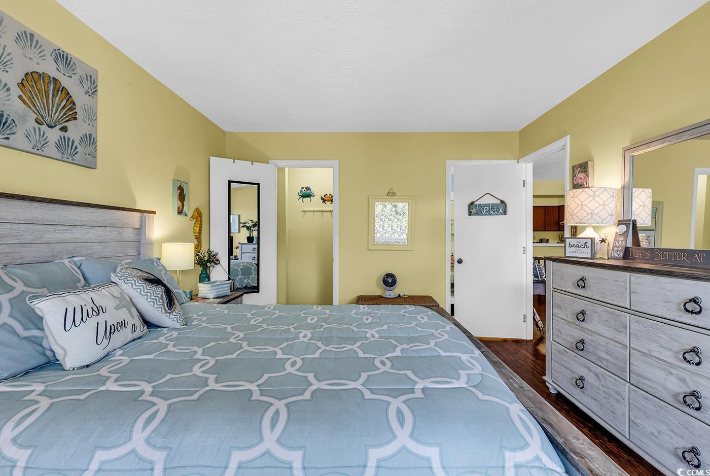 310 5th Avenue North, Unit 302 Surfside Beach, SC 29575 - Photo 24 of 39 Master Bedroom with Sliding door to balcony, walk in closet and ensuite master bath