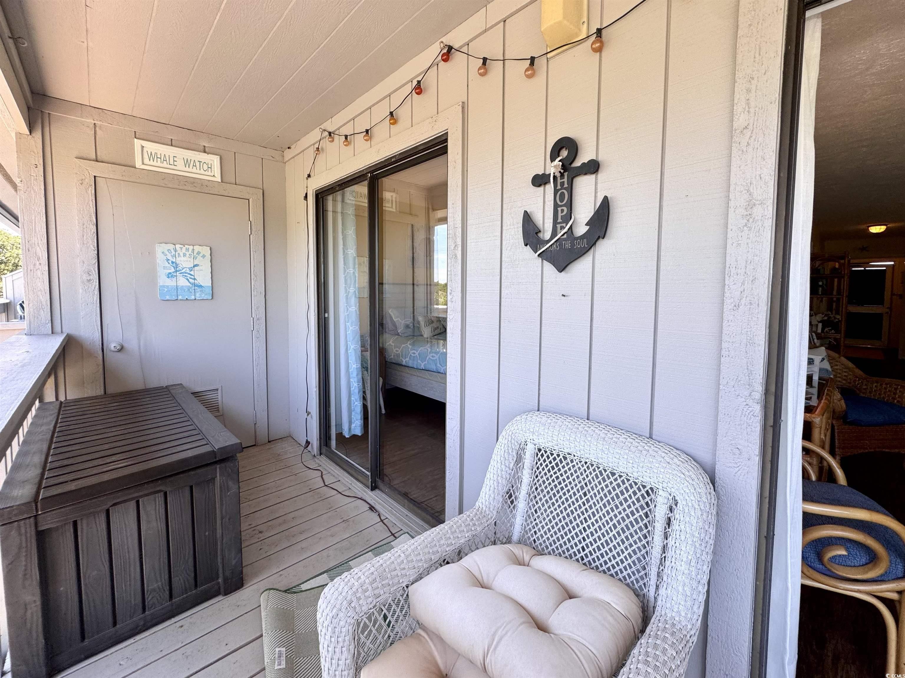 310 5th Avenue North, Unit 302 Surfside Beach, SC 29575 - Photo 32 of 39 View of balcony with storage room and sliders off bedroom