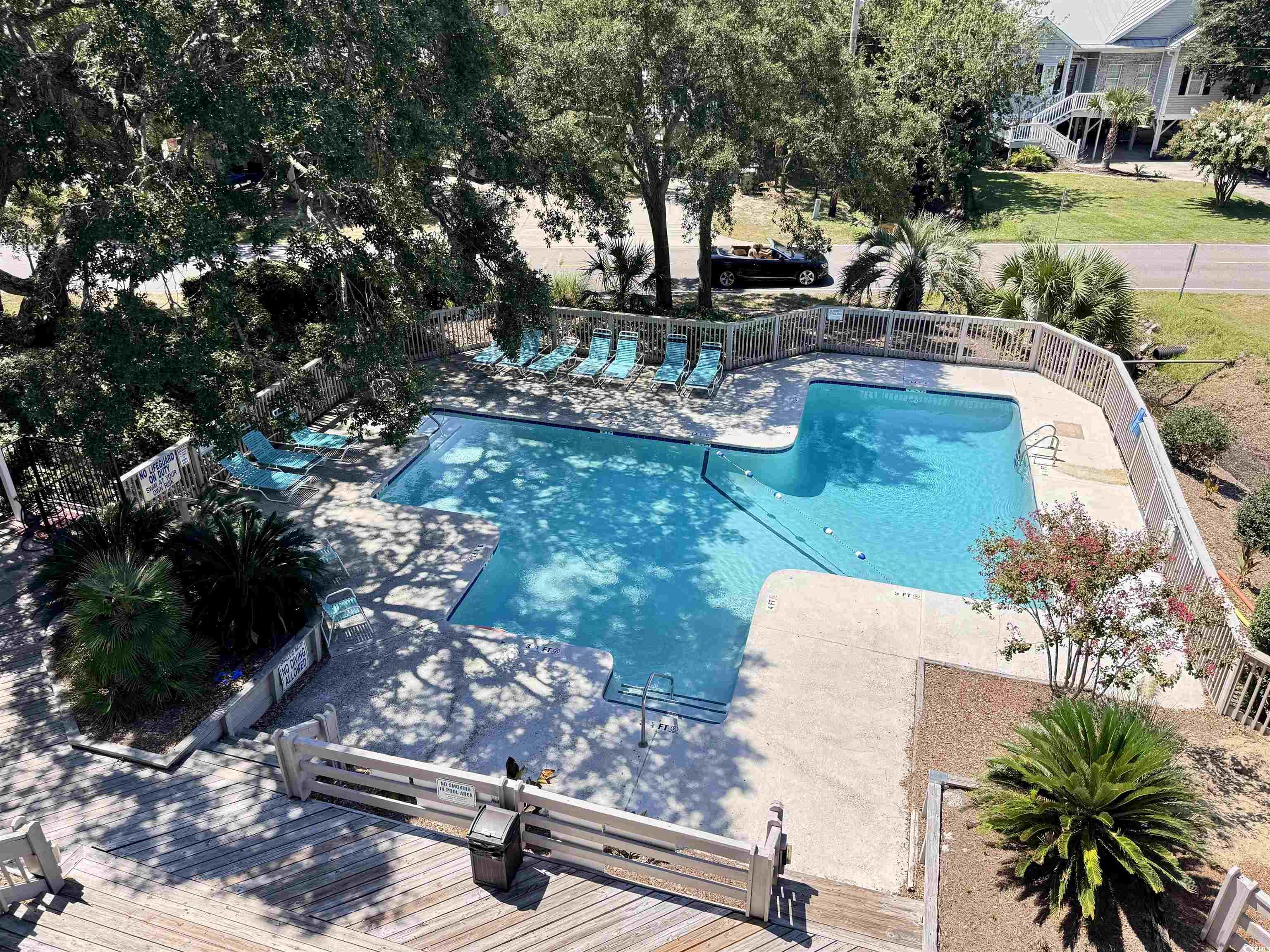 310 5th Avenue North, Unit 302 Surfside Beach, SC 29575 - Photo 39 of 39 Community pool featuring a deck and a patio