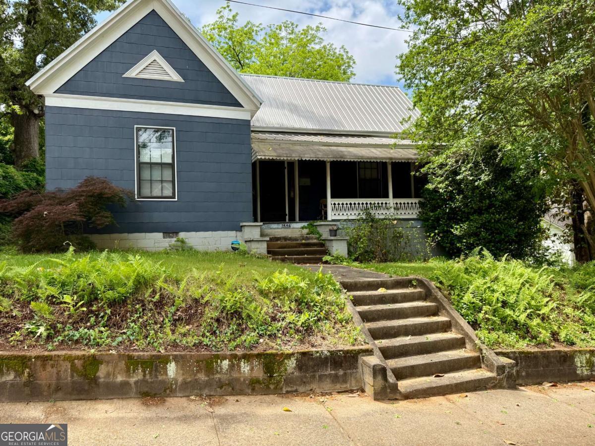 1451 West Broad Street Athens, GA 30601 - Photo 10 of 21 a front view of a house with a yard