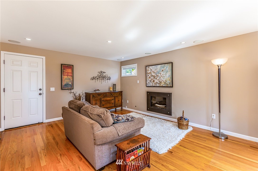 24229 15th Place Southeast Bothell, WA 98021 - Photo 14 of 40 a living room with furniture and a fireplace