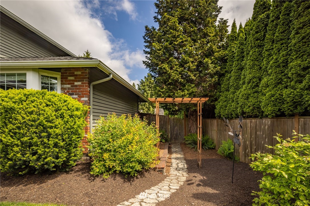 24229 15th Place Southeast Bothell, WA 98021 - Photo 3 of 40 a front view of a house with a yard