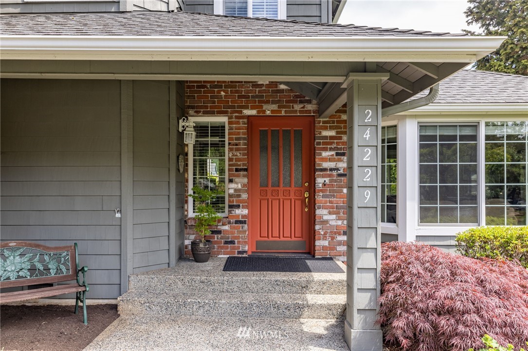 24229 15th Place Southeast Bothell, WA 98021 - Photo 4 of 40 a front view of a house with a garden
