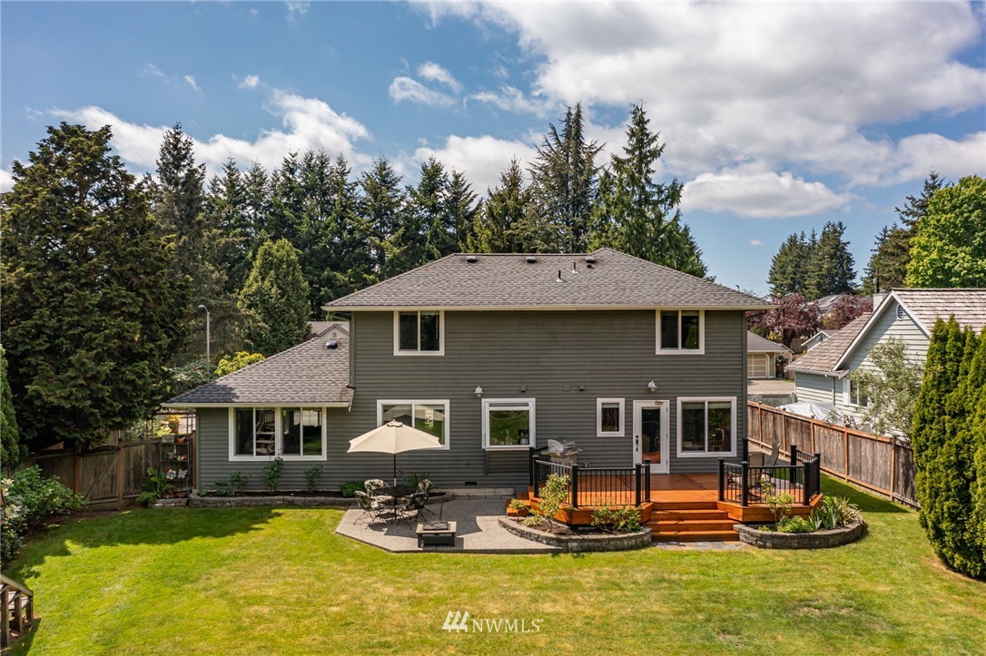 24229 15th Place Southeast Bothell, WA 98021 - Photo 34 of 40 a front view of a house with a yard table and chairs