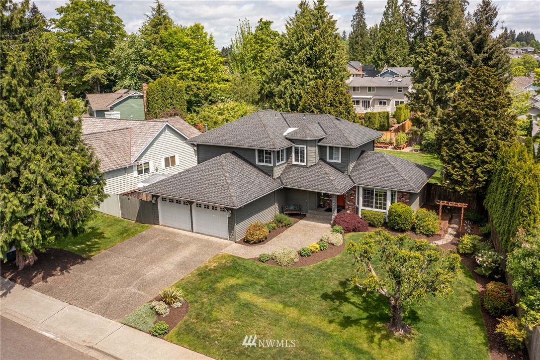 24229 15th Place Southeast Bothell, WA 98021 - Photo 36 of 40 an aerial view of a house with a yard and trees