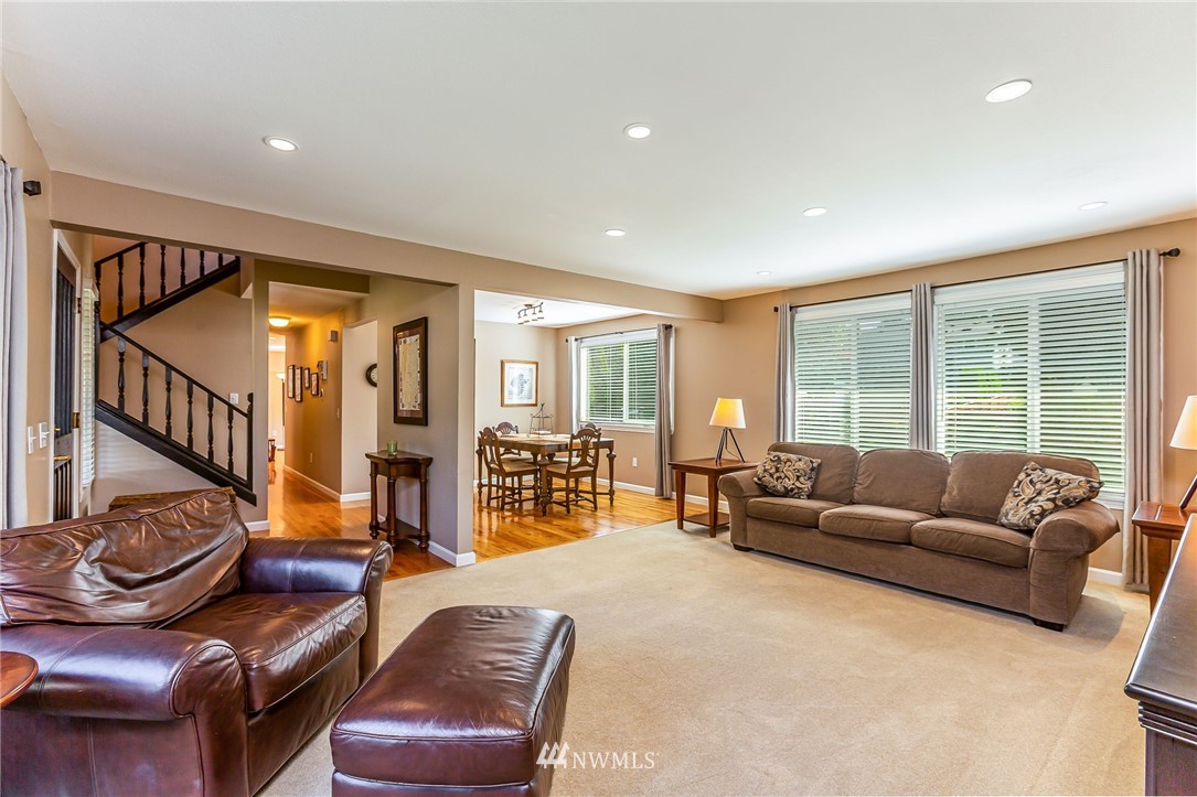 24229 15th Place Southeast Bothell, WA 98021 - Photo 5 of 40 a living room with furniture ceiling fan and a large window