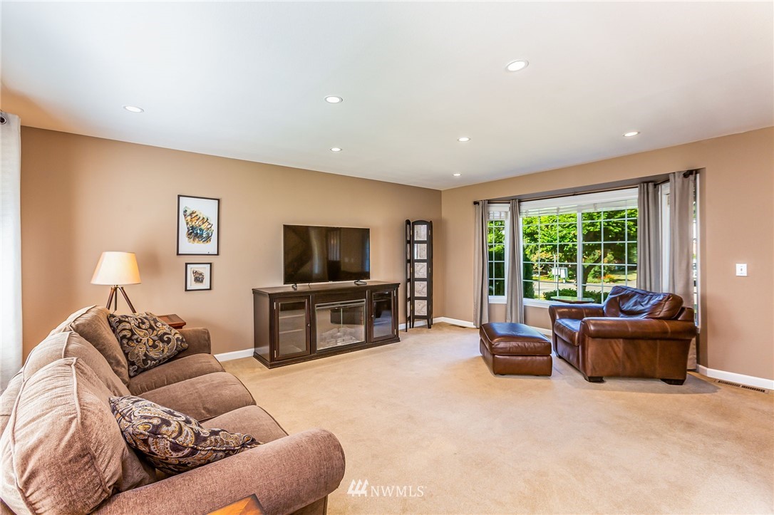 24229 15th Place Southeast Bothell, WA 98021 - Photo 6 of 40 a living room with furniture window and flat screen tv