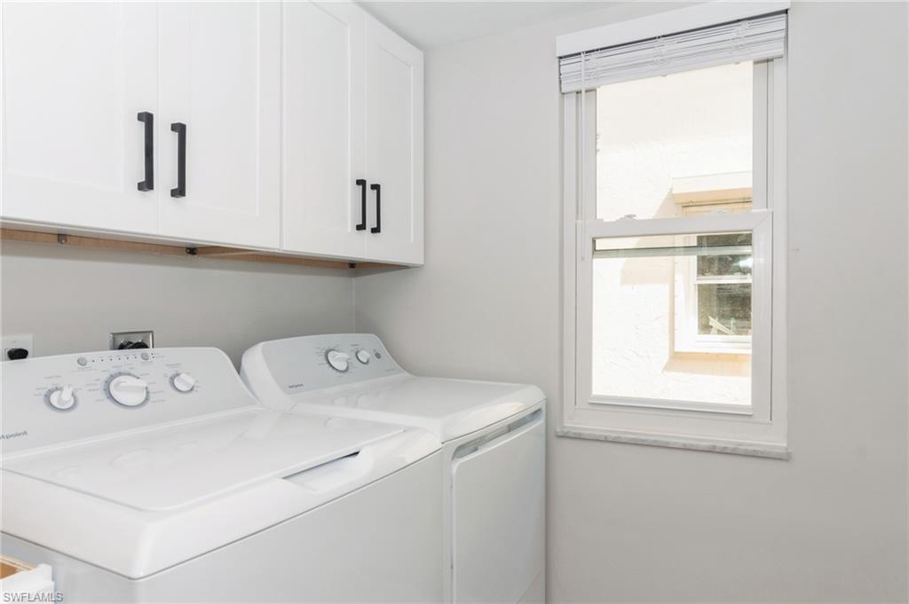 1155 Sandpiper Street, Unit B3 Naples, FL 34102 - Photo 14 of 21 Laundry area featuring cabinet space and washer and clothes dryer