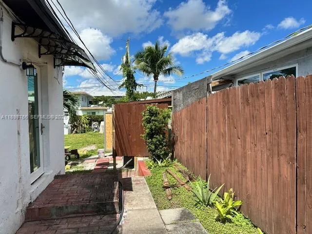 a view of a house with a garden