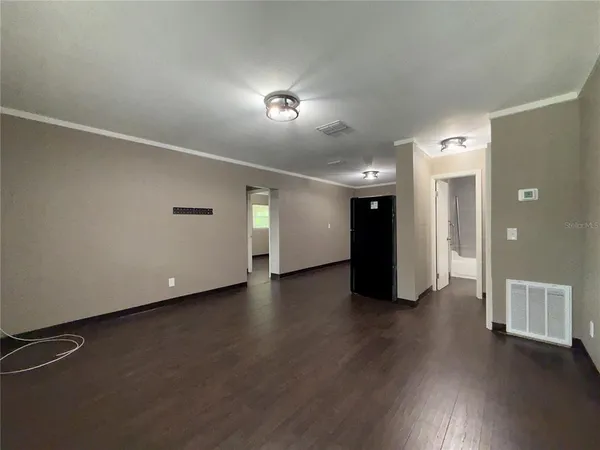 a view of a livingroom with wooden floor