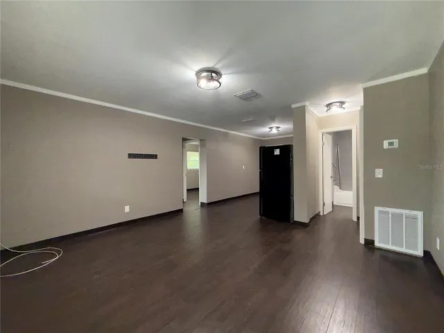 a view of a livingroom with wooden floor