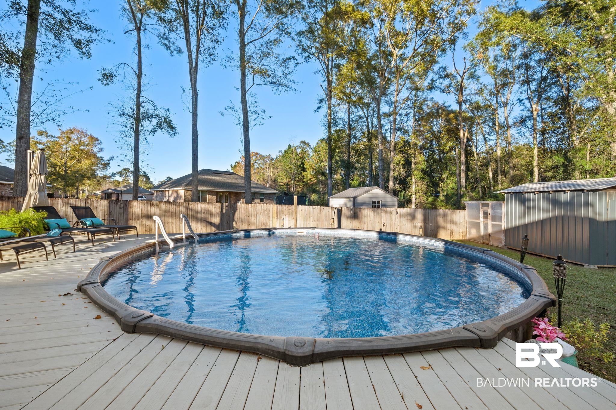 9366 Fox Run Court Semmes, AL 36575 - Photo 24 of 29 View of pool featuring a wooden deck