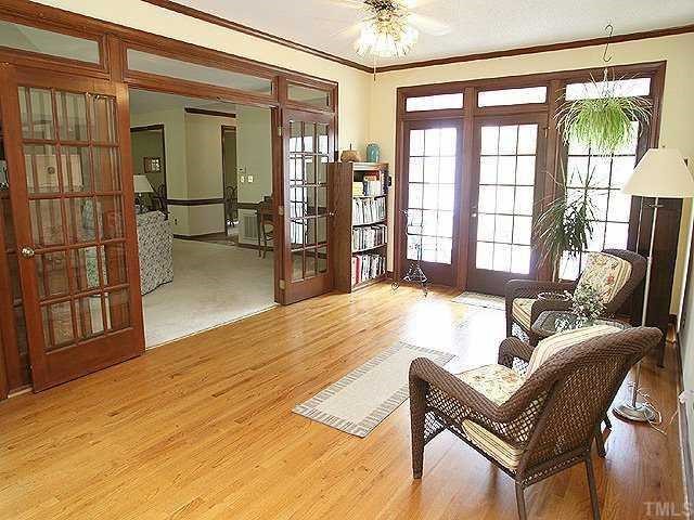 5220 Leiden Lane Raleigh, NC 27606 - Photo 8 of 12 Ah, the sunroom with its gleaming hardwood floors. Perfect place to curl up with a good book.